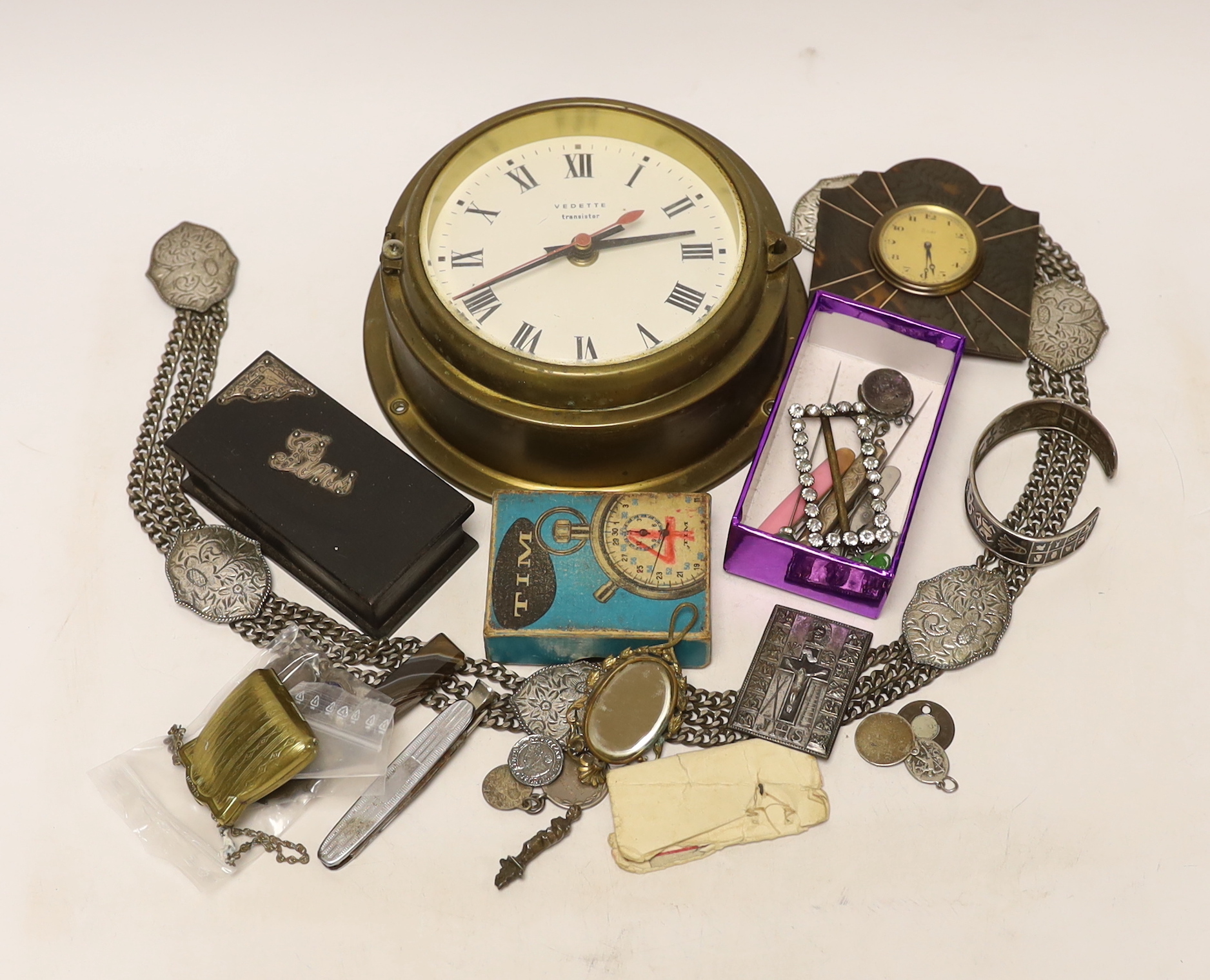 A quantity of mixed collectibles to include an eight day tortoiseshell and metal mounted travel clock, etc.